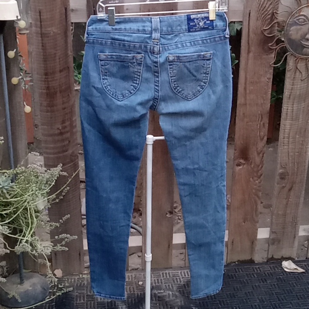 Woman's jeans distress, blue size 28. Leg Inseam 29 inches. Stretch